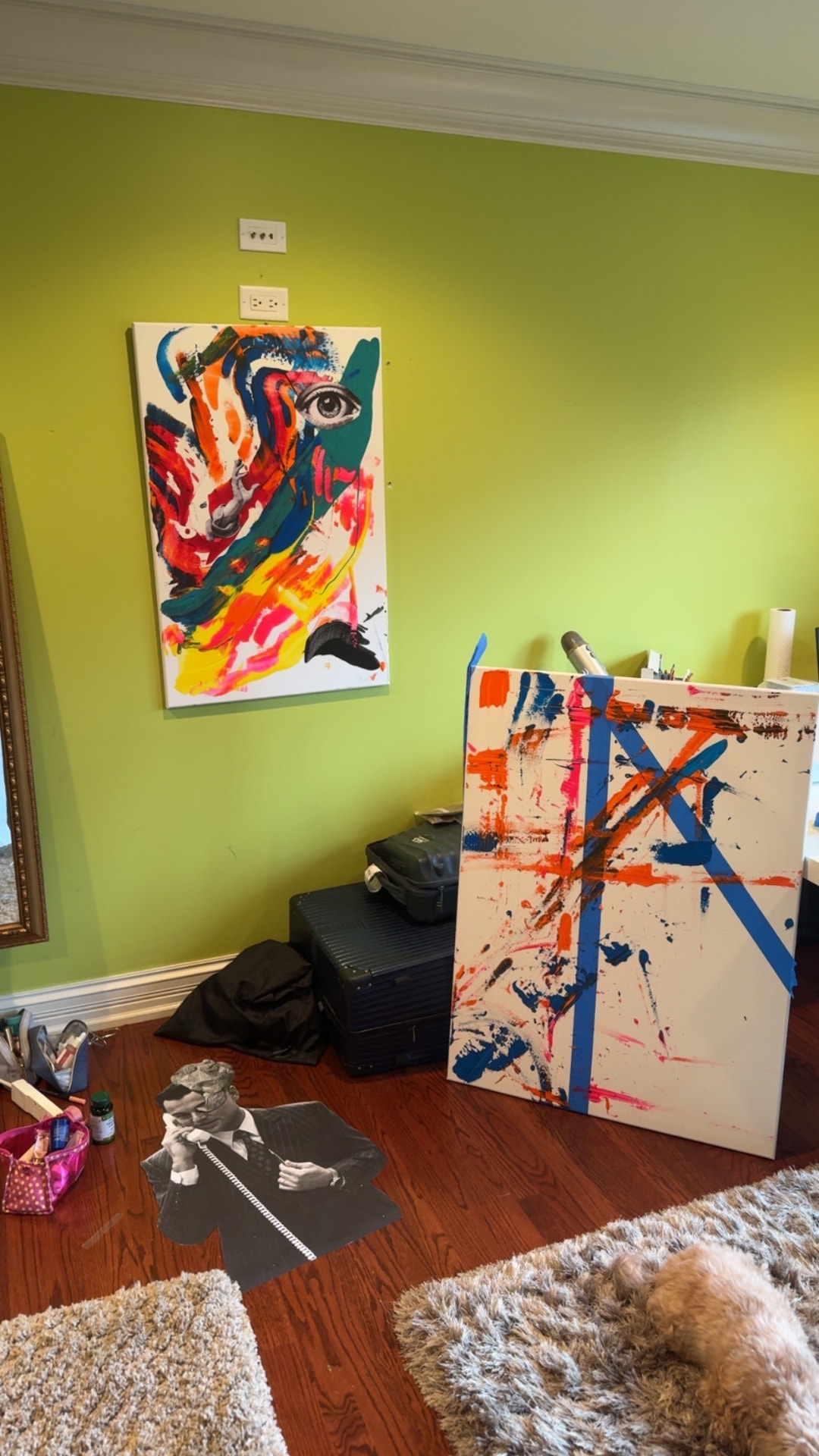 A candid studio scene with The Witness and another painting in progress